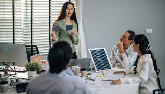 Startup team presents innovative, sustainable solar cell prototype. Reduce electricity costs, resource consumption, carbon footprint. Foster creative communication, eco-friendly decision-making. Startup team presents innovative, sustainable solar cell prototype. Reduce electricity costs, resource consumption, carbon footprint. Foster creative communication, eco-friendly decision-making.
